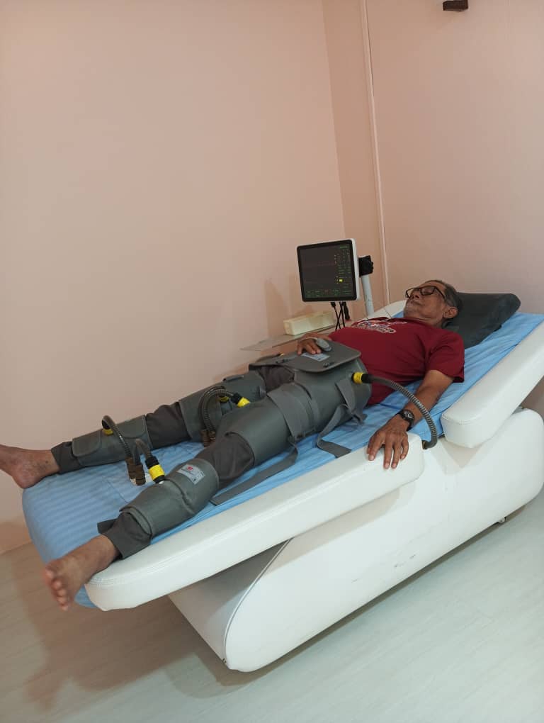 Modern medical massage therapy equipment showing therapeutic cuffs for circulation treatment